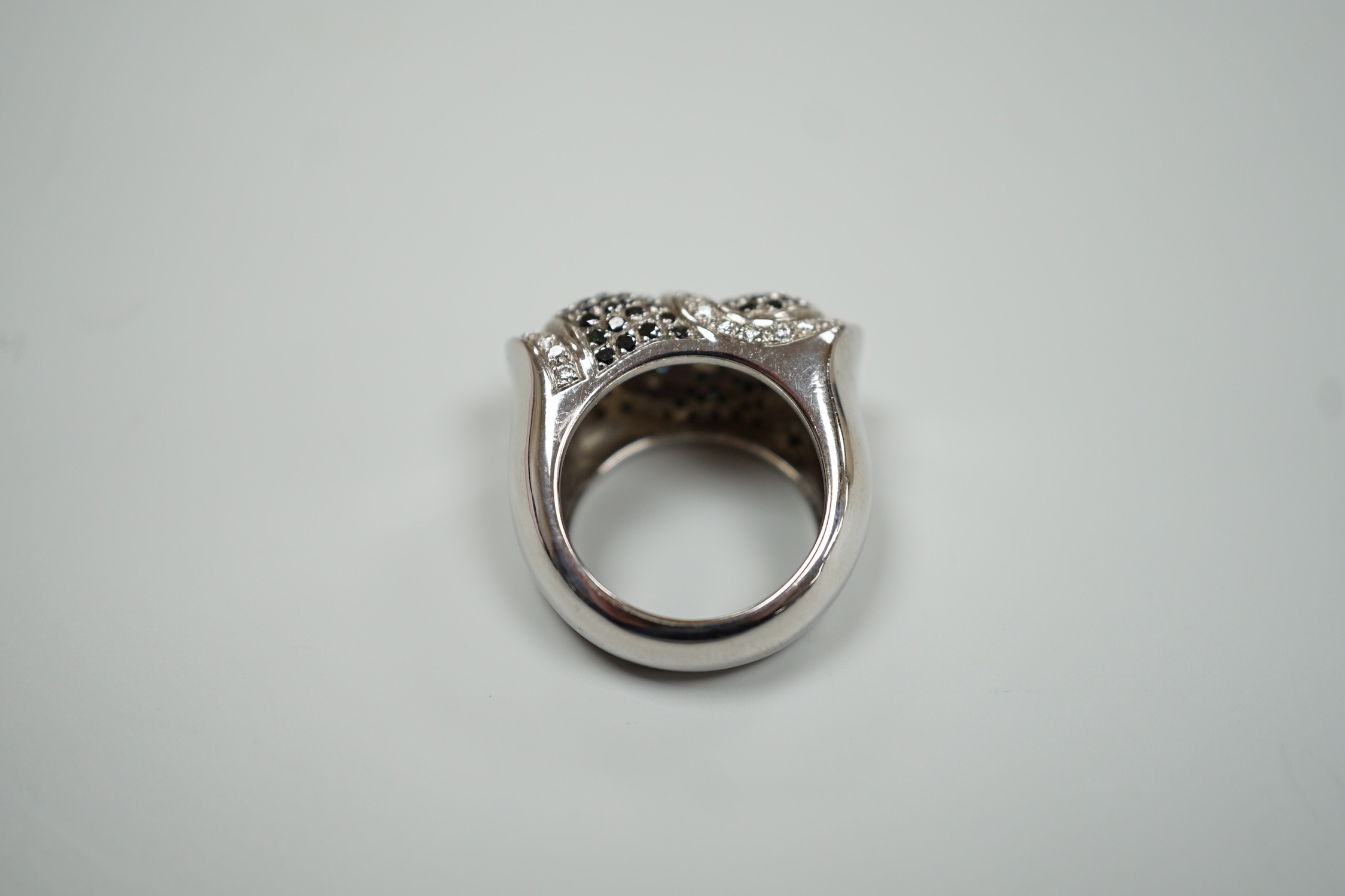 A modern 750 white metal and pave set two colour diamond dress ring, size K/L, gross weight 15.4 grams.